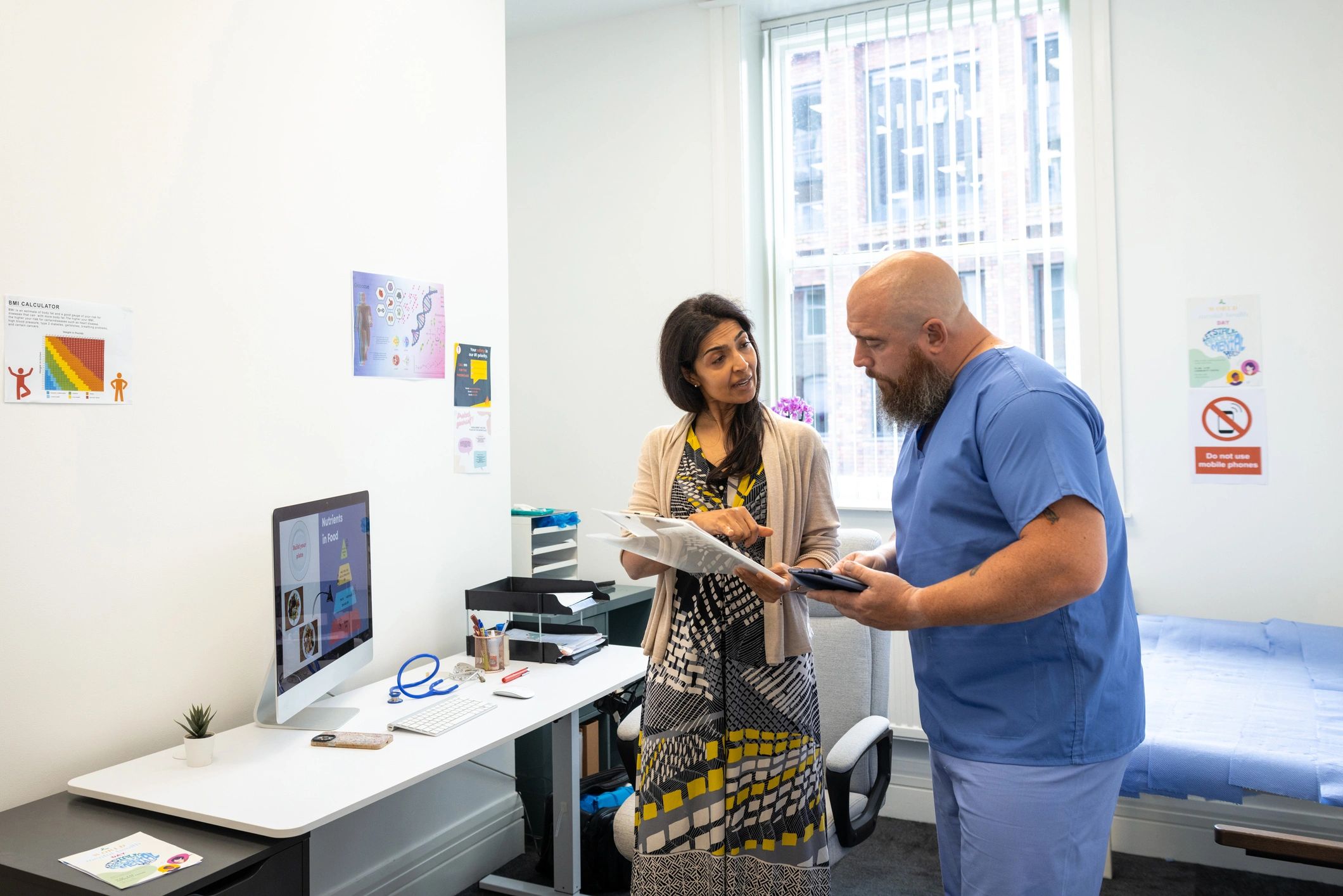 Healthcare professionals discussing patient care in an office